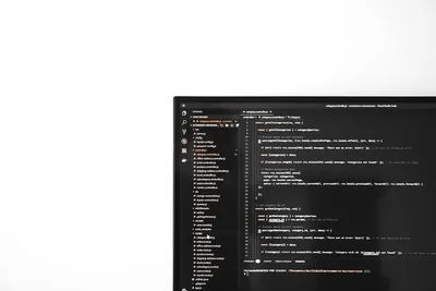 Developer at a computer with code on the screen for an article by Atlanta based Software Engineer, Namir Ahmed.