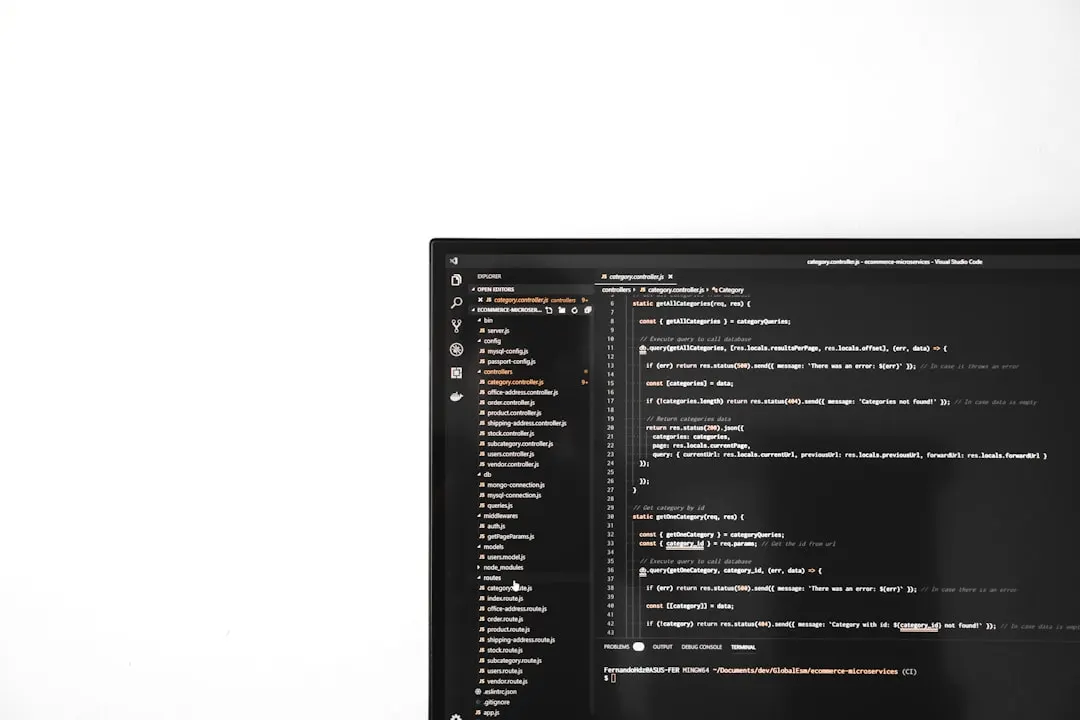 Developer at a computer with code on the screen for an article by Atlanta based Software Engineer, Namir Ahmed.